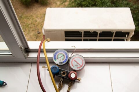 HVAC gauges testing the faulty AC sensor by Grissom Heat & Air in Knoxville, TN
